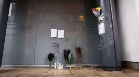 MEN Floral tributes to Manchester door and RIP message scrawled on wall where Vladislav Kavur, known to his friends as Diego, was found after taking a fatal overdose 